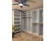 Walk-in closet with custom shelving and ample storage space in a neutral color palette at 106 Condover Pl, Charlotte, NC 28270