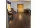 Open-concept living room with hardwood floors, ample space, and bright natural light at 106 Condover Pl, Charlotte, NC 28270