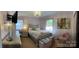 Comfortable main bedroom with soft lighting, a plush bed, and stylish decor at 106 Condover Pl, Charlotte, NC 28270