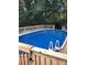 Enjoy this backyard pool with a new wooden deck that is perfect for summer fun and relaxation at 106 Condover Pl, Charlotte, NC 28270