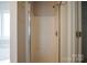 This bathroom features a glass-door shower stall with wall-mounted shower head at 11021 Travis Gulch Dr, Charlotte, NC 28277