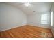 Bright bedroom with hardwood floors, a ceiling fan, and ample natural light at 11021 Travis Gulch Dr, Charlotte, NC 28277