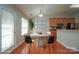 Bright dining area featuring a modern concrete table and natural light from a large window at 11021 Travis Gulch Dr, Charlotte, NC 28277