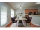 Dining area featuring a modern table, stylish chairs, and access to an outdoor patio at 11021 Travis Gulch Dr, Charlotte, NC 28277