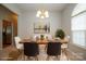 Elegant dining room with a modern table setting, stylish chairs, and an eye-catching chandelier at 11021 Travis Gulch Dr, Charlotte, NC 28277