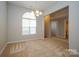 Bright dining room with natural light, chandelier and neutral colors perfect for entertaining or Gathering meals at 11021 Travis Gulch Dr, Charlotte, NC 28277
