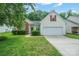 Charming single-Gathering home with a well-manicured lawn, mature trees, and a two-car garage at 11021 Travis Gulch Dr, Charlotte, NC 28277