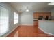 A kitchen features a bar counter, cabinets, stainless steel appliances, and access to the backyard at 11021 Travis Gulch Dr, Charlotte, NC 28277