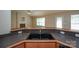 Kitchen sink featuring a bar, stainless steel appliances, countertops, cabinets, and a sink at 11021 Travis Gulch Dr, Charlotte, NC 28277