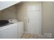 Functional laundry room with washer, dryer, and access to the outside, simplifying chores at 11021 Travis Gulch Dr, Charlotte, NC 28277