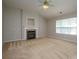 Cozy living room with a fireplace, carpet, and ample natural light, ideal for relaxing or entertaining guests at 11021 Travis Gulch Dr, Charlotte, NC 28277