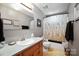 Neutral bathroom featuring a single sink vanity and shower/tub combination at 116 April Ln, Dallas, NC 28034