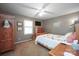 Inviting bedroom with warm carpet, ceiling fan, and charming decor at 116 April Ln, Dallas, NC 28034