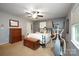 Bedroom with ceiling fan, neutral carpet, and stylish bed and decor at 116 April Ln, Dallas, NC 28034