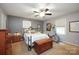 Bedroom with ceiling fan, neutral carpet, and stylish bed and decor at 116 April Ln, Dallas, NC 28034