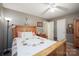 Cozy bedroom featuring wood furnishings, a quilted bedspread, and a ceiling fan with overhead lighting at 116 April Ln, Dallas, NC 28034