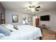 Well-lit bedroom with carpet, ceiling fan, and comfortable decor at 116 April Ln, Dallas, NC 28034