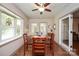 Cozy dining area with wood flooring, natural light, and a view of the backyard at 116 April Ln, Dallas, NC 28034