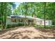Traditional home exterior with red shutters, a well-maintained yard, and an attached garage at 116 April Ln, Dallas, NC 28034