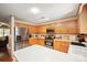 Bright kitchen with stainless steel appliances, oak cabinets, and an island with white countertops at 116 April Ln, Dallas, NC 28034