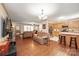 An open living room with wood floors, plush sofas, and an adjacent kitchen area at 116 April Ln, Dallas, NC 28034