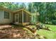 Cozy screened porch with outdoor seating and scenic views of the landscaped backyard at 116 April Ln, Dallas, NC 28034