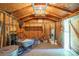 Functional shed interior, ideal for a workshop, with exposed beams, tools, and ample storage at 116 April Ln, Dallas, NC 28034
