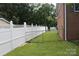 Spacious backyard with a white fence and green lawn at 116 Woodbark Ln, Kings Mountain, NC 28086