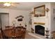 Dining room features a fireplace, built-in shelves, and traditional furniture at 116 Woodbark Ln, Kings Mountain, NC 28086