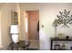 Charming entryway with decorative accents, a stylish table lamp, and a glimpse into a striped hallway at 116 Woodbark Ln, Kings Mountain, NC 28086