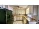 Well lit kitchen featuring black appliances, granite countertops, and tiled flooring at 116 Woodbark Ln, Kings Mountain, NC 28086