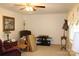 Bright living room featuring a ceiling fan, decorative lighting, and carpeted floors at 116 Woodbark Ln, Kings Mountain, NC 28086