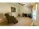 Comfortable living room with patterned armchair, side table, and a window at 116 Woodbark Ln, Kings Mountain, NC 28086