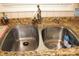 Stainless steel double sink with granite countertop and chrome faucet at 116 Woodbark Ln, Kings Mountain, NC 28086