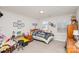 Cozy bedroom decorated with dance-themed decor, featuring a bed, desk, and a sitting area at 11618 Macallano Dr, Charlotte, NC 28215