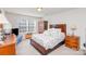 Inviting bedroom with a large window, dresser, and closet at 11618 Macallano Dr, Charlotte, NC 28215
