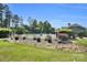 Well-maintained community pool area with a black fence and ample seating for residents at 11618 Macallano Dr, Charlotte, NC 28215