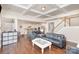 Bright, open floor plan living area adjacent to a kitchen and a staircase at 11618 Macallano Dr, Charlotte, NC 28215