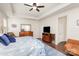 Comfortable main bedroom with ceiling fan, wood floors, a dresser and sitting area at 11618 Macallano Dr, Charlotte, NC 28215