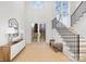 Bright entryway with hardwood floors, staircase, and large windows at 1321 Ferncliff Rd, Charlotte, NC 28211