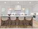 Bright, modern kitchen island with seating and pendant lights at 1321 Ferncliff Rd, Charlotte, NC 28211