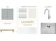 Laundry room design featuring modern tile, white cabinets, white quartz countertop, and brushed nickel hardware and fixtures at 1321 Ferncliff Rd, Charlotte, NC 28211