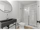 Modern bathroom with a black sink and glass-enclosed shower at 1356 Briar Creek Rd, Charlotte, NC 28205