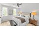 Bright bedroom featuring a comfortable bed, modern fan, and natural light from large windows at 1356 Briar Creek Rd, Charlotte, NC 28205