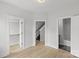 Spacious room with closet, staircase, and bathroom access, providing functionality and flow at 1356 Briar Creek Rd, Charlotte, NC 28205