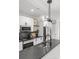 Sleek kitchen features an island with a stylish pendant light and modern appliances at 1356 Briar Creek Rd, Charlotte, NC 28205