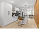 Modern kitchen featuring white cabinets, a black countertop island and stainless appliances at 1356 Briar Creek Rd, Charlotte, NC 28205