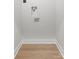 Empty laundry room with hardwood floors and washer/dryer hookups, ready for appliances at 1356 Briar Creek Rd, Charlotte, NC 28205