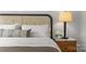 Relaxing bedroom details showcasing a bedside lamp, stylish decor, and a comfortable bed setup at 1356 Briar Creek Rd, Charlotte, NC 28205