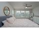 Bedroom featuring a ceiling fan, large windows, and a round mirror at 154 Stella Ln # A, Troutman, NC 28166